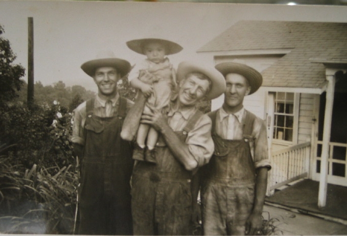 Allen Lester Korns and his three sons, Melvin, Alvin and Luther.