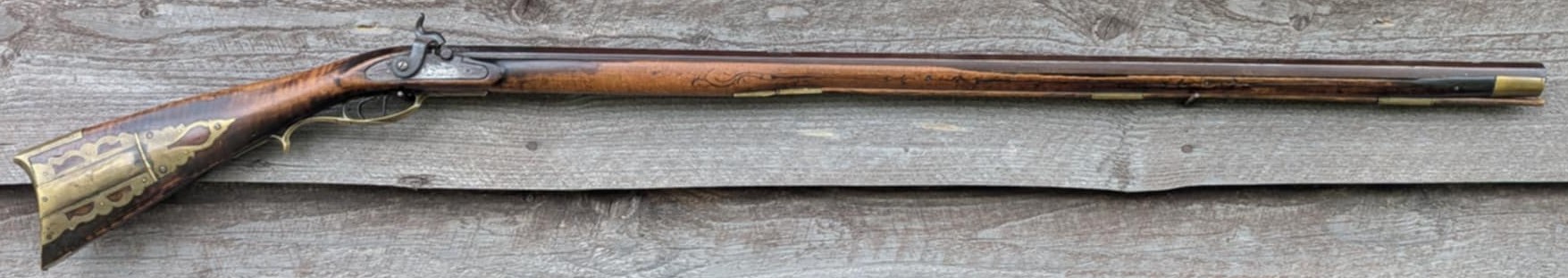 Full stock Jacob Mier black powder rifle.