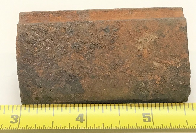 A side view of the long rifle nose cap forming tool, showing its length.