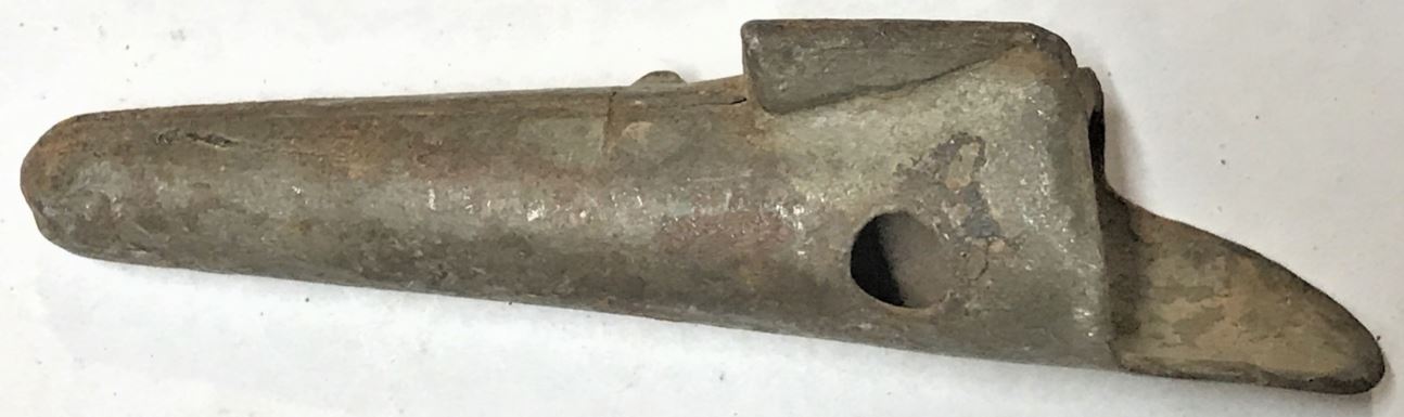 A sheet metal sugar water tap that was purchased at a 1970s auction in Southampton Township, Somerset County, Pennsylvania.
